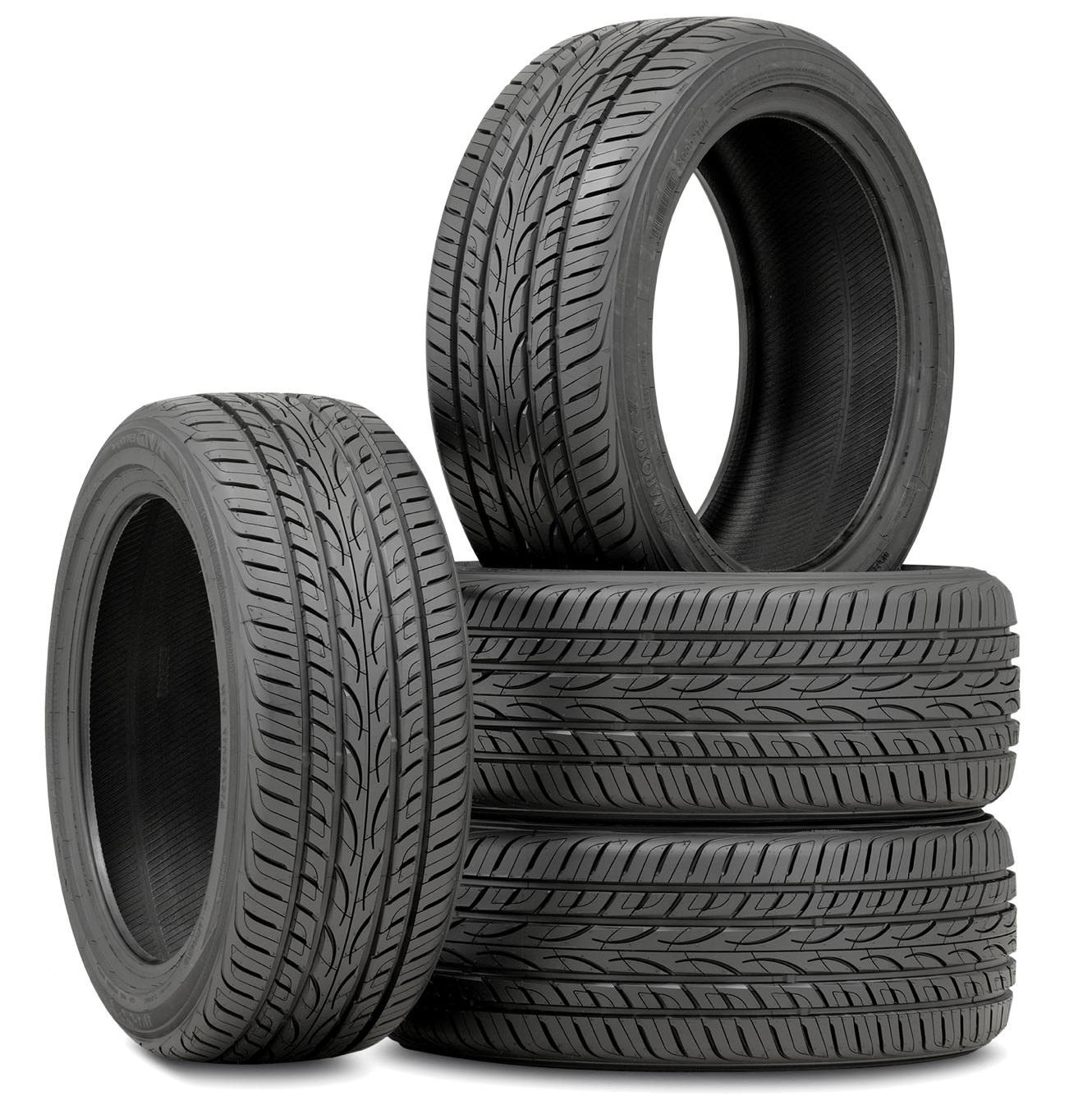 a stack of 4 new premium tyres at Mid Wales Tyres Ltd